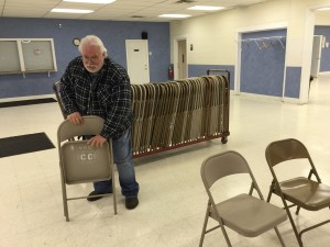 Johm, KC9OOO setting up chairs