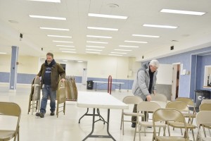 Norm, N9IRO and Granville, W9PNG setting up chairs